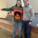 L.B. Wiggins (left) won first place in the ugly Christmas sweater contest with Brian Welton, administrator and CEO of Baptist North Mississippi
