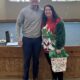 Stephanie Bramlitt (right) won second place in the ugly Christmas sweater contest with Brian Welton, administrator and CEO of Baptist North Mississippi